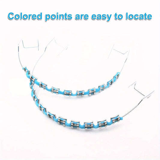 Handmade colorful Easter-themed metal braces with decorative hooks, wires, and lashing - bright, orange, blue, and black designs for holiday smile customization, tooth decoration