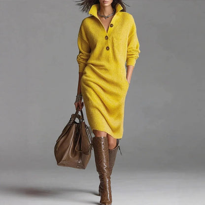 Woman wearing yellow fall winter sweater dress with long sleeves and button details carrying brown handbag and brown knee-high boots